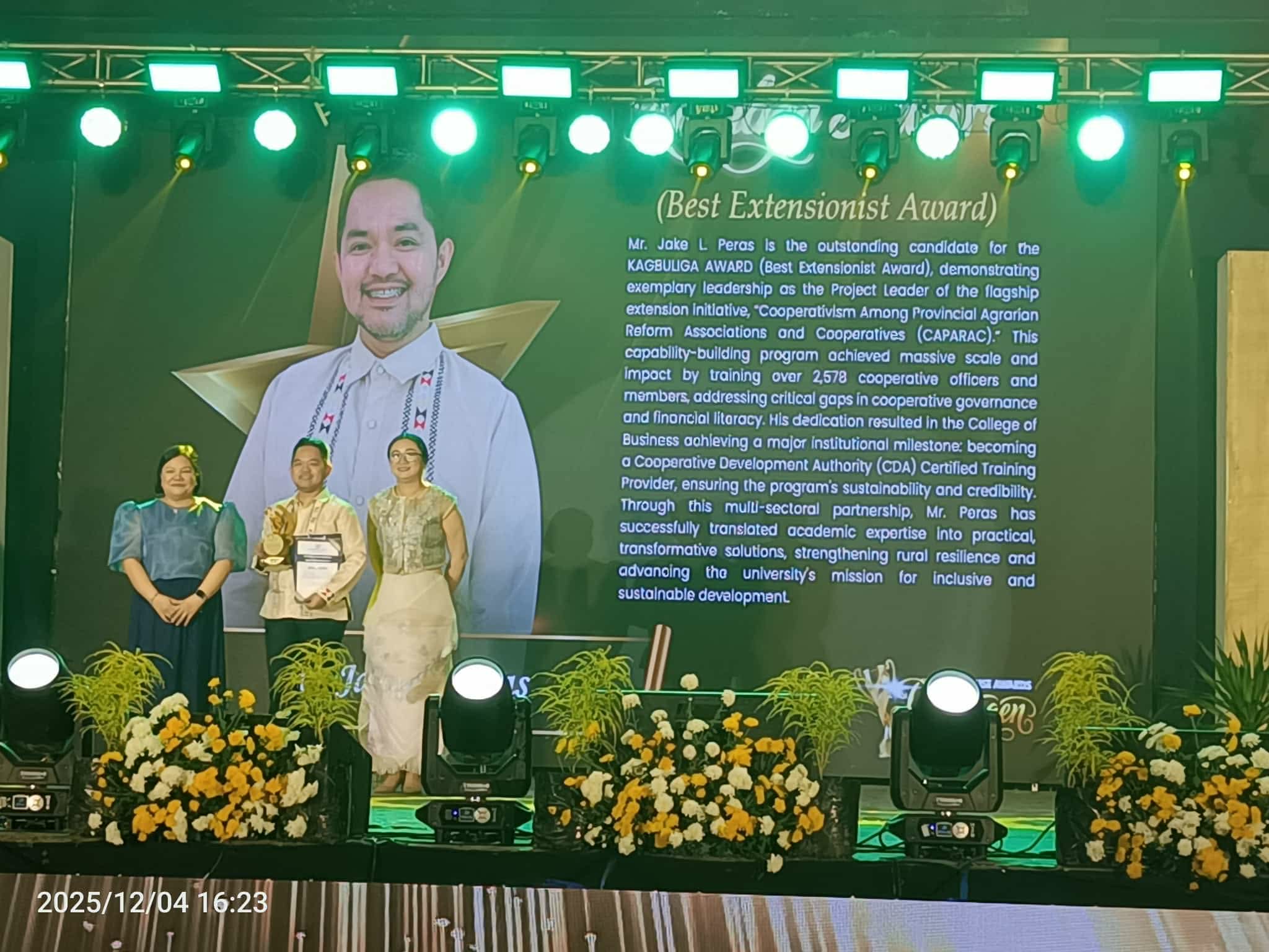 Jake L. Peras receiving the Kagbuliga Award as Best Extensionist at Bukidnon State University